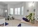 Bright bathroom features a double vanity, blue accent rug, and large window for an abundance of natural light at 402 Walls Way, Osprey, FL 34229