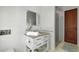 Cozy bathroom featuring a stand-alone vanity with neutral countertops, storage, and a glass-enclosed shower at 402 Walls Way, Osprey, FL 34229