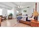 A bedroom with wooden floors, four poster bed, stylish furnishings, and natural light at 402 Walls Way, Osprey, FL 34229