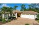 Beautiful home featuring a brick driveway and an attached three-car garage at 402 Walls Way, Osprey, FL 34229