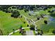 Aerial view of a lush green golf course with ponds and manicured landscaping at 402 Walls Way, Osprey, FL 34229