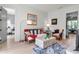 Bright living room features cozy furniture, hardwood floors, and an open floor plan at 402 Walls Way, Osprey, FL 34229