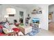 Bright living room features cozy furniture, hardwood floors, and built-in entertainment center at 402 Walls Way, Osprey, FL 34229