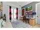 Bright office with French doors, built-in shelving, and contemporary furnishings at 402 Walls Way, Osprey, FL 34229