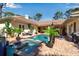 Stunning pool and patio area with lush tropical landscaping, a jacuzzi, and comfortable outdoor seating area at 402 Walls Way, Osprey, FL 34229