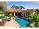 Relaxing pool area with mature landscaping, patio furniture, and inviting sun loungers on a brick-paved deck at 402 Walls Way, Osprey, FL 34229