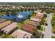 Aerial view of homes nestled along a lake, highlighting the community's layout and lush surroundings at 4134 63Rd E Ter, Sarasota, FL 34243