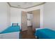 Spare bedroom featuring two twin beds, neutral walls, and open doors at 4134 63Rd E Ter, Sarasota, FL 34243
