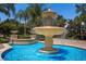 A beautiful water fountain in a community area with flowing water and lush landscaping on a sunny day at 4134 63Rd E Ter, Sarasota, FL 34243