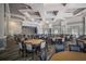 Elegant event room with tables, chairs, and a stage, ideal for gatherings and celebrations at 4134 63Rd E Ter, Sarasota, FL 34243