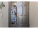 Elegant front door with decorative glass panel and brushed metal hardware at 4134 63Rd E Ter, Sarasota, FL 34243