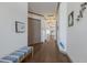Bright hallway with hardwood floors, crown molding, and neutral paint at 4134 63Rd E Ter, Sarasota, FL 34243