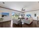 Comfortable living room with lake views, modern furniture, and a neutral color palette at 4134 63Rd E Ter, Sarasota, FL 34243