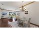 Open-concept living and dining area with views of the lake and access to the outdoors at 4134 63Rd E Ter, Sarasota, FL 34243