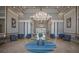 Inviting lobby with a modern chandelier, stylish seating, and a welcoming atmosphere at 4134 63Rd E Ter, Sarasota, FL 34243