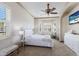Sun-filled main bedroom with bay windows, ceiling fan, and an arched doorway at 4134 63Rd E Ter, Sarasota, FL 34243