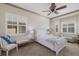 Main bedroom featuring windows with shutters, ceiling fan and detailed trim at 4134 63Rd E Ter, Sarasota, FL 34243