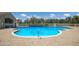 Inviting community pool, perfect for cooling off and relaxing on sunny days with ample brick decking at 4134 63Rd E Ter, Sarasota, FL 34243
