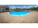 Inviting community pool, perfect for cooling off and relaxing on sunny days with ample brick decking at 4134 63Rd E Ter, Sarasota, FL 34243