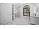 Bright and modern bathroom with walk-in glass shower and double sink at 4444 Robin Hood Trl W, Sarasota, FL 34232