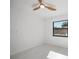Well-lit bedroom features a ceiling fan and window at 4444 Robin Hood Trl W, Sarasota, FL 34232