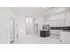 Modern kitchen with stainless steel appliances, island, and sleek countertops for a contemporary feel at 4444 Robin Hood Trl W, Sarasota, FL 34232