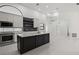 Open kitchen design with island, stainless appliances, and seamless access to living spaces at 4444 Robin Hood Trl W, Sarasota, FL 34232