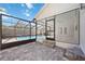 View of the outdoor pool and patio area featuring stone pavers at 4444 Robin Hood Trl W, Sarasota, FL 34232
