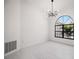 Bright room with a large window, modern lighting, and minimalist design at 4444 Robin Hood Trl W, Sarasota, FL 34232