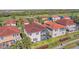 An aerial view shows the house, pool, and surrounding community landscaping at 4510 Murcia Blvd # 16, Sarasota, FL 34238