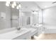 Elegant bathroom features double sinks, a large mirror, and a soaking tub at 4624 Blue Marlin Dr, Bradenton, FL 34208