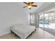 Bedroom with wood-look floors and sliding glass door access to the pool area at 4624 Blue Marlin Dr, Bradenton, FL 34208