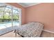 Bedroom with sliding glass doors that lead to the pool at 4624 Blue Marlin Dr, Bradenton, FL 34208