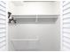 A simple white closet with shelving and a hanging rod at 4624 Blue Marlin Dr, Bradenton, FL 34208