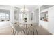 Bright dining area with modern white furniture and ample natural light at 4624 Blue Marlin Dr, Bradenton, FL 34208