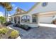 Well-maintained home showcasing beautiful arched windows and a stylish walkway at 4624 Blue Marlin Dr, Bradenton, FL 34208