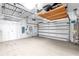 Spacious two-car garage offering ample storage and overhead shelving units at 4624 Blue Marlin Dr, Bradenton, FL 34208