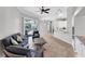 Cozy living room with tiled floors leading to a kitchen and direct access to the lanai at 4624 Blue Marlin Dr, Bradenton, FL 34208
