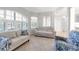 Relaxing living room featuring large windows and comfortable seating at 4624 Blue Marlin Dr, Bradenton, FL 34208