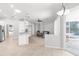 Open-concept living room with tile floors and sliding glass doors to the pool area at 4624 Blue Marlin Dr, Bradenton, FL 34208