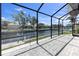 A screened in outdoor patio with brick pavers looks out to a beautiful canal at 4624 Blue Marlin Dr, Bradenton, FL 34208