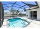 Refreshing pool in screened lanai, providing a perfect spot for relaxation and recreation at 4624 Blue Marlin Dr, Bradenton, FL 34208