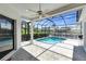 Relaxing screened-in pool area with ceiling fan, offering a private outdoor retreat at 4624 Blue Marlin Dr, Bradenton, FL 34208