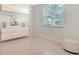 Bright bedroom featuring a large window, built-in storage, and contemporary decor at 4912 Old Oakleaf Dr, Sarasota, FL 34233