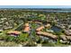 Extensive aerial view of the community, highlighting its waterfront location and lush surroundings at 5201 Lake Village Dr # 14, Sarasota, FL 34235