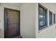 Inviting entryway with neutral walls, showing the front door and window, providing natural light at 5201 Lake Village Dr # 14, Sarasota, FL 34235