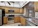Efficient kitchen featuring stainless steel appliances, ample cabinet space, and a convenient countertop at 5201 Lake Village Dr # 14, Sarasota, FL 34235