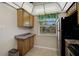 Cozy kitchen space with wood cabinets, granite countertops, and stainless steel appliances at 5201 Lake Village Dr # 14, Sarasota, FL 34235