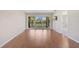 Bright living room with sliding glass doors leading to a balcony, complete with sleek wood flooring at 5201 Lake Village Dr # 14, Sarasota, FL 34235