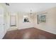 Inviting living room featuring modern wood floors and ample natural light with views into the kitchen at 5201 Lake Village Dr # 14, Sarasota, FL 34235